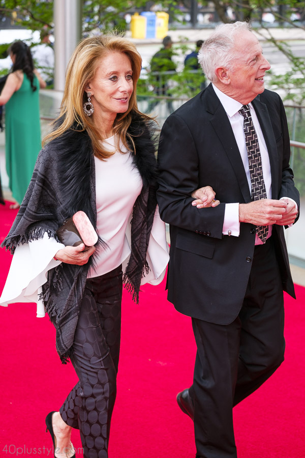 Draping a black wrap on a white top will create a beautiful contrast with one's outfit | 40plusstyle.com