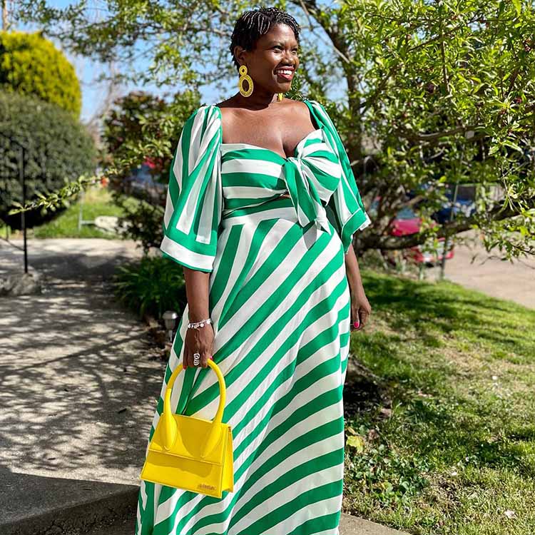 Hide your belly with the right clothes - Georgette wears a stripe dress | 40plusstyle.com