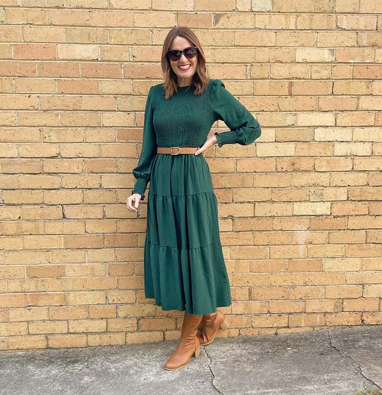 Dresses for the fall - Karen wears a green tiered dress with boots | 40plusstyle.com