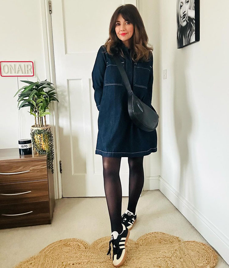 Nicola wears a denim dress and sneakers | 40plusstyle.com