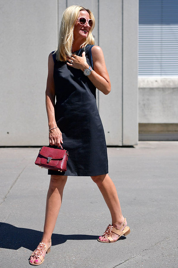 Outfit idea: Styling a black dress with a red leather purse | 40plusstyle.com